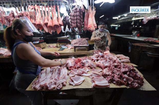 Meat-vendors-in-Commonwealth-Market-Quezon-City-3-620x413